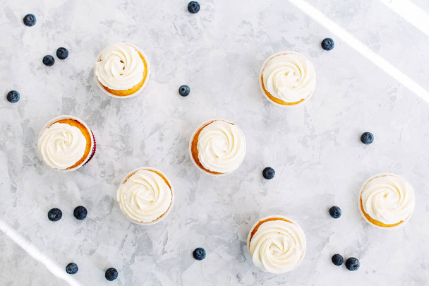 cupcakes and blueberries on marble  - 写真・画像