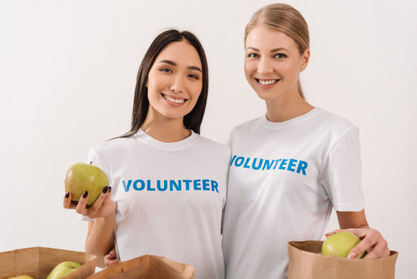 female volunteers with apples - Photo, Image