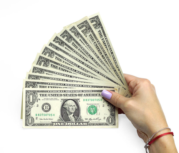Γυναικεία χέρια θεωρούν δολάρια - Φωτογραφία, εικόνα