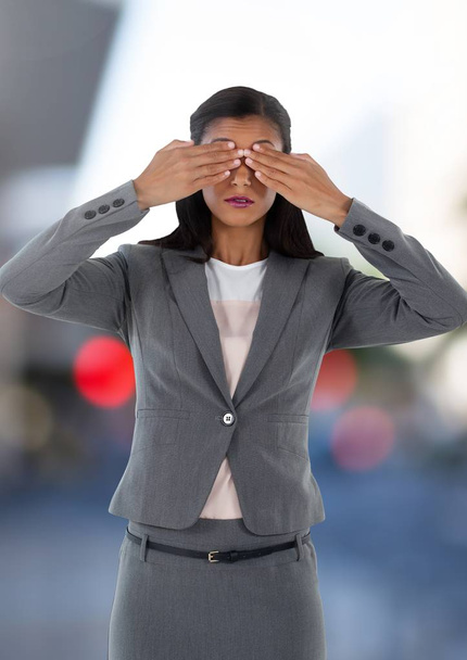 Businesswoman holding hands over eyes - Photo, image
