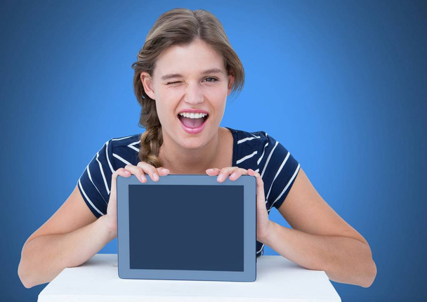 Woman holding tablet with blue background - Φωτογραφία, εικόνα