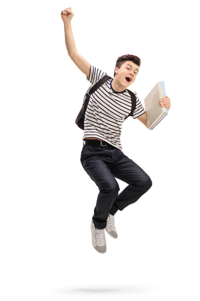 teenage student jumping and gesturing happiness - Fotoğraf, Görsel