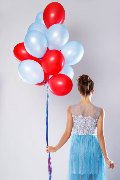 Young woman with colorful balloons - Fotoğraf, Görsel