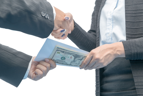 Businessmen making handshake with money under envelope - Fotó, kép