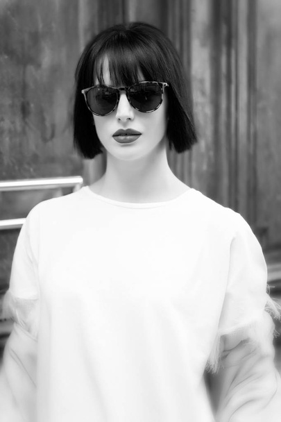 Girl in fashionable glasses and shirt. - Valokuva, kuva
