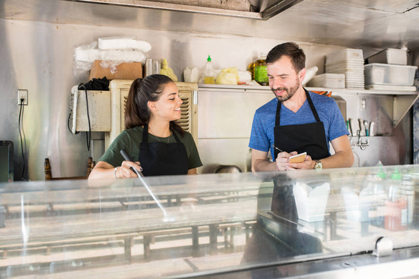Two people working in food truck - Photo, Image