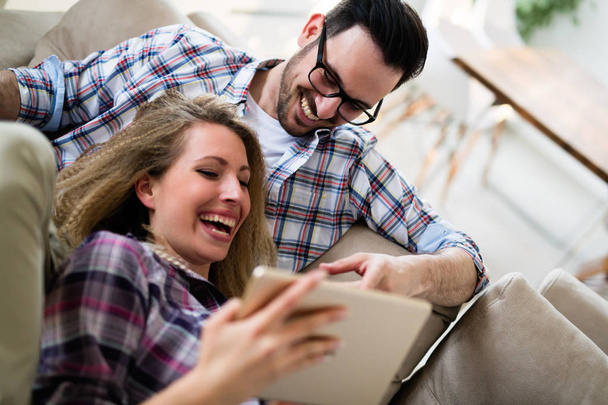 Happy couple in love surfing on tablet  - Photo, Image
