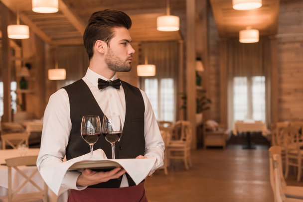waiter holding tray with wineglasses  - Fotografie, Obrázek