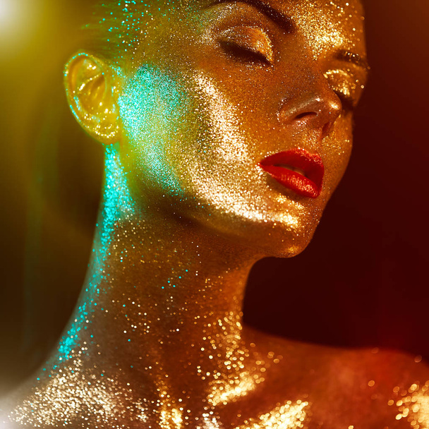 Portrait of beautiful woman with sparkles on her face - Foto, Imagen