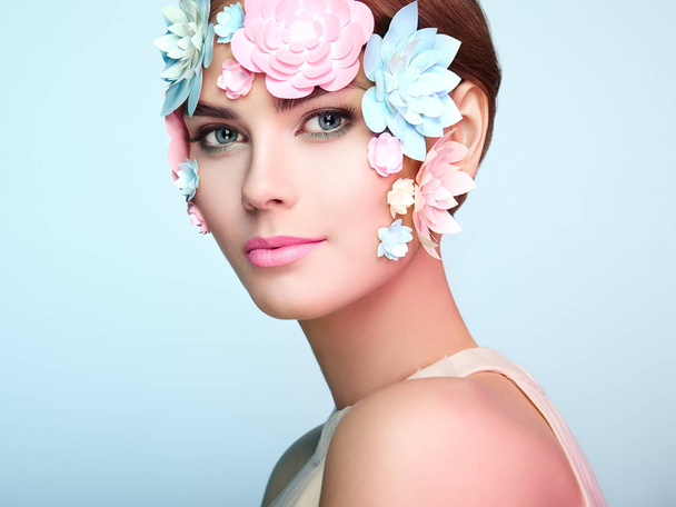 Face of beautiful woman decorated with flowers - Foto, immagini