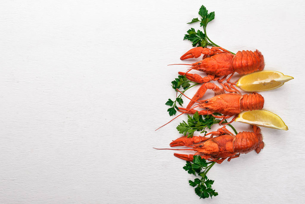 Lobster. Seafood. On a wooden background. Top view. Free space for your text. - Photo, Image