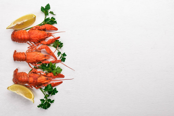 Lobster. Seafood. On a wooden background. Top view. Free space for your text. - Foto, Imagen