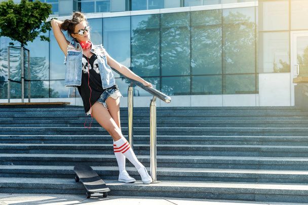 Stylish girl with skateboard  - Фото, зображення