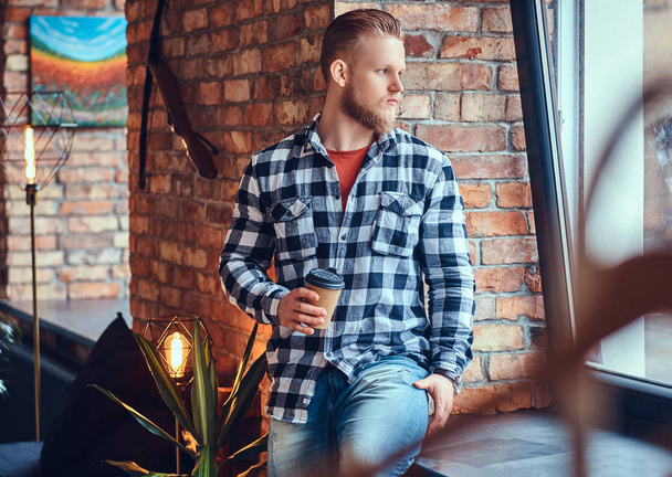 Blond hipster male drinks coffee. - Photo, image