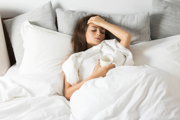 Sick woman under blanket - Photo, image