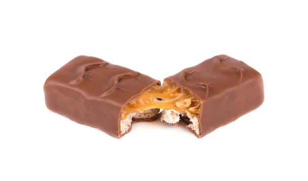 Closeup of chocolate,peanut and caramel bar isolated on white background, with clipping path - Photo, Image