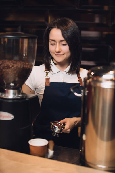 Barista at work preparing coffee - Photo, image