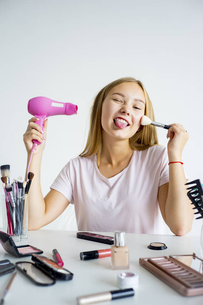 Girl applying makeup - Photo, Image