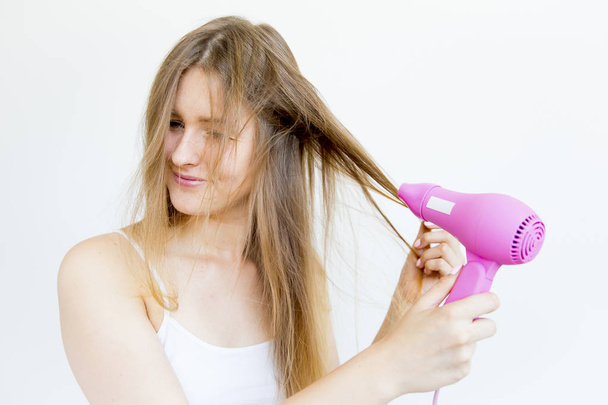 Girl taking care of her hair - Foto, imagen