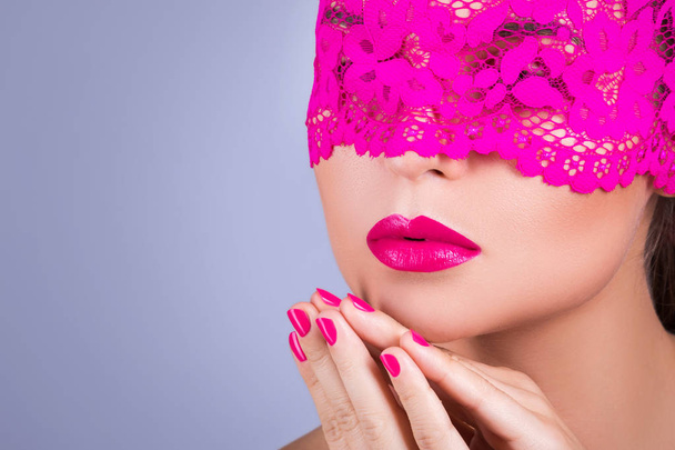 woman with elegant pink blindfold - Fotó, kép