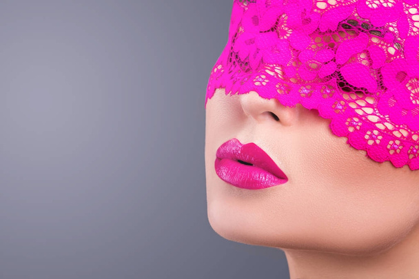 woman with elegant pink blindfold - Photo, Image