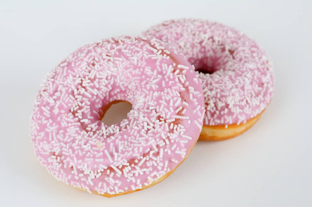 Donut rosa com polvilhas
 - Foto, Imagem