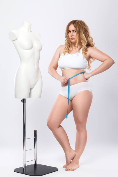 Woman is unhappy with progress of weight-loss - Photo, Image