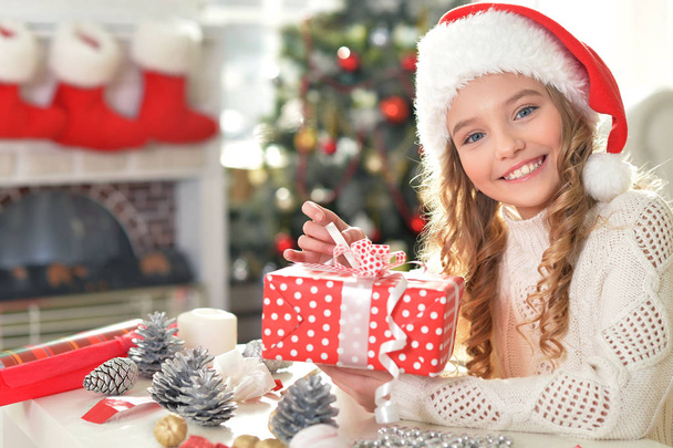 Girl with  Christmas present - Фото, изображение