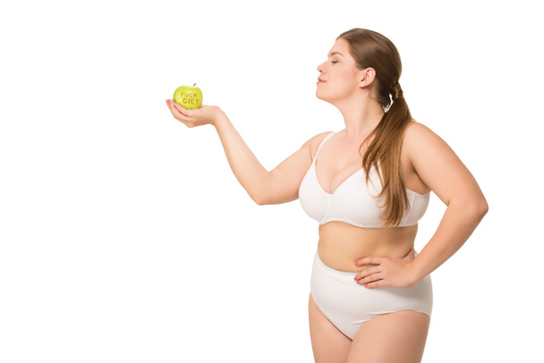 Mujer gorda sosteniendo manzana
 - Foto, Imagen