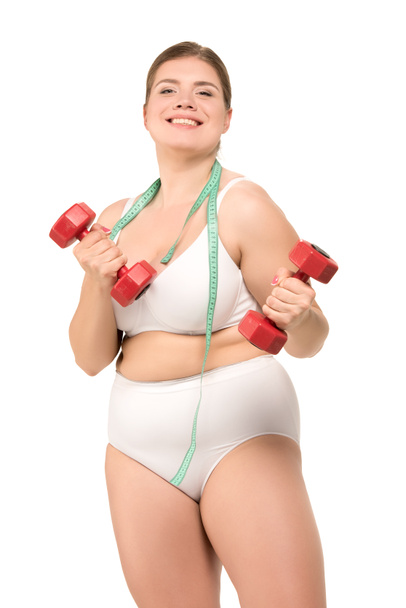 overweight woman training with dumbbells - Photo, Image