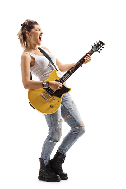 Punk girl singing and playing an electric guitar - Fotografie, Obrázek