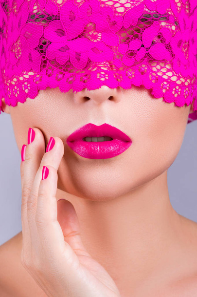 woman with elegant pink blindfold - Foto, Imagen