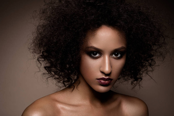Fashion studio portrait of beautiful african american woman with perfect smooth glowing mulatto skin, make up - Photo, Image