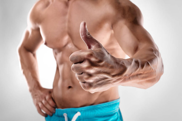 man bodybuilder showing thumbs up gesture - Photo, Image