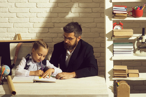 Home education concept. Man and kid do homework - Foto, Imagem
