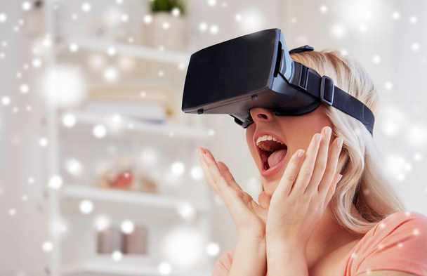 woman in virtual reality headset or 3d glasses - 写真・画像