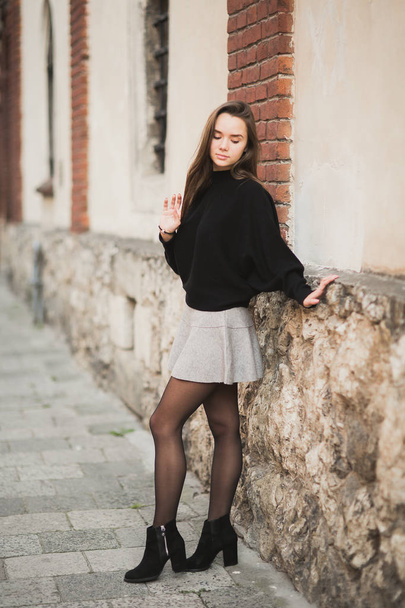 Fashion woman portrait of young pretty trendy girl posing at the city in Europe - Foto, Imagem