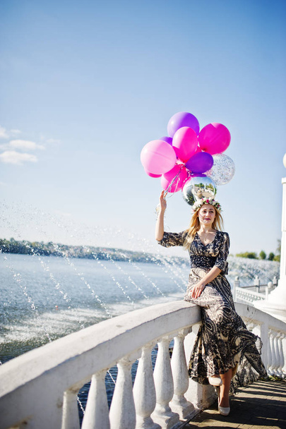 Girl blonde with balloons at hen party against lake. - Foto, immagini