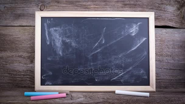 Are You Covered.Text on a chalkboard background - Footage, Video