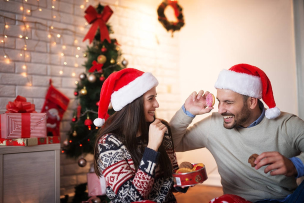 happy couple celebrating Christmas at home - 写真・画像