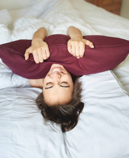 young woman lying on bed - Fotó, kép