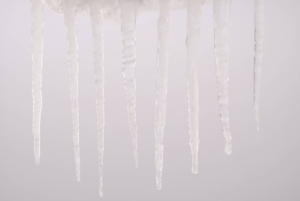 Icicle isolated on a grey  - Photo, Image