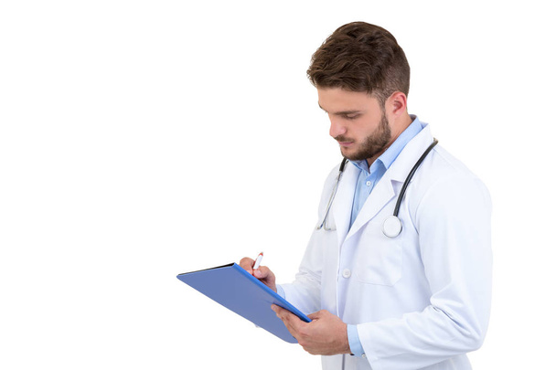 Male Doctor standing with folder, isolated on white background - Valokuva, kuva