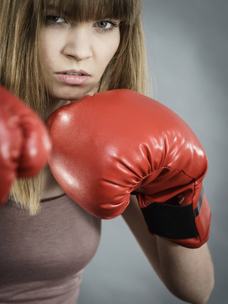 Woman wearing boxing gloves - Foto, Imagen