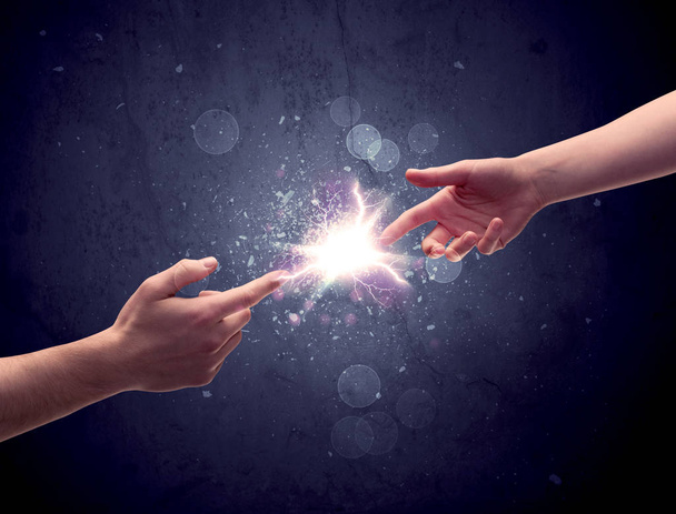 Hands reaching to light a spark - Фото, зображення