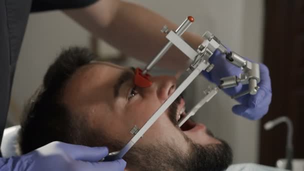 Installation of the face-bow. Modern technology. Dental clinic - Footage, Video