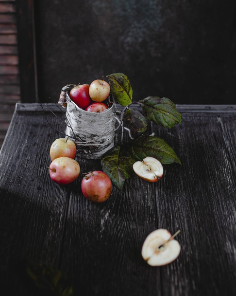 Ripe apples in metal jar - 写真・画像