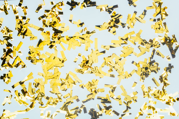 Złoty błyszczący konfetti - Zdjęcie, obraz