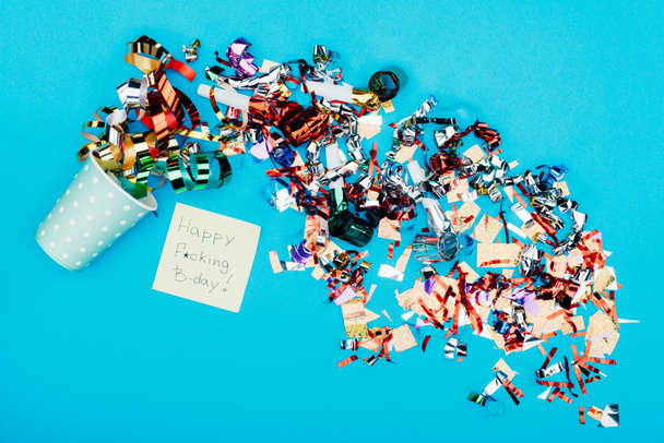 confetti pouring from paper cup - 写真・画像