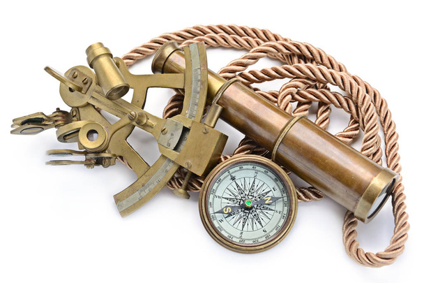 compass,sextant and spyglass on the white - Photo, Image